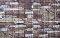 Stone wall texture background with brown and white inserts.