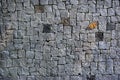 Stone wall texture background. wall of gray granite blocks. butterfly sitting on a stones. painted lady butterfly. stone granite p Royalty Free Stock Photo