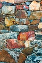 Stone wall texture background. Old outdoor rocks surface of a medieval fortress. Close-up natural rustic pattern.
