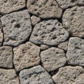 Stone wall texture featuring irregular interlocking blocks with a Royalty Free Stock Photo