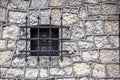 Stone wall texture with old medieval window Royalty Free Stock Photo