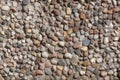 Stone wall texture, road made of small round stones Royalty Free Stock Photo