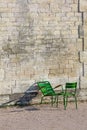 Stone wall and two green chairs in Tuileries Garden (Vertical)
