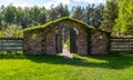 Stone wall, wooden gate, entrance to the Bible Garden Royalty Free Stock Photo