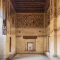 Stone wall with wooden window Mashrabiya and mural depicting city of Medina at Beit El Set Waseela building, Cairo, Egypt Royalty Free Stock Photo