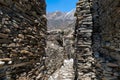 Stone walls in Annapurna circuit trek, Ghyaru in Nepal under blue sky Royalty Free Stock Photo