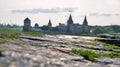 Stone walls with Kamianets-Podilskyi castle in the background, Ukraine Royalty Free Stock Photo