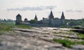 Stone walls with Kamianets-Podilskyi castle in the background, Ukraine Royalty Free Stock Photo