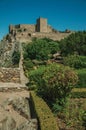 Stone walls and tower of Castle over hill near garden at Marvao Royalty Free Stock Photo