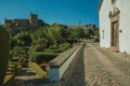 Tower of Castle over hill with lush flowered garden Royalty Free Stock Photo