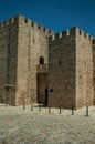 Stone walls and towers in the front facade of the Elvas Castle