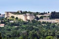 Stone walls and towers of the medieval Castle  in the city of Avignon Royalty Free Stock Photo