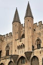 Stone walls and towers of the medieval Castle of the Popes in the city of Avignon Royalty Free Stock Photo