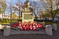 Stone war monument with red poppy display Royalty Free Stock Photo