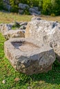 Stone water bowl at Roman wells in Rajcice