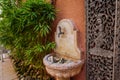 Stone water fountain, marble sink, built in house wall, mediterranean style