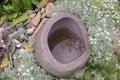 Stone water pot with arrangement Royalty Free Stock Photo