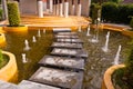 Stone way on water with fountain Royalty Free Stock Photo