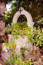 Stone well for water decorated with flowers