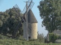 Stone windmill building in the vines in France Royalty Free Stock Photo