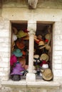 Stone window of a hat shop, in a medieval house. Royalty Free Stock Photo