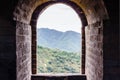 Stone window with a view of the mountain