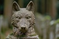 stone wolf statue in forest Royalty Free Stock Photo