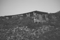 Stone and wood shed built into rocky hillside