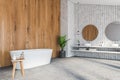 Stone and wooden bathroom corner, tub and sink Royalty Free Stock Photo