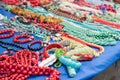 Stone and wooden necklaces and bracelets at market stall, souvenir store Royalty Free Stock Photo