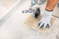 Stone worker sawing, working with power tools in construction site Royalty Free Stock Photo