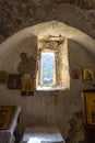 Stoned church interior in the ruins of Acrocorinth ancient ruined fortress on a sunny day