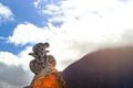 Stoned sculpture of cyclist on blue sky background. Tour de Fran