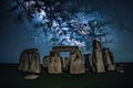 Stonehedge at night under sky with stars
