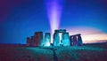 Stonehenge like monument with blue beam emitted from core