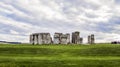 Stonehenge prehistoric monument, green grass, clouds, panoramic view - Wiltshire, Salisbury, England