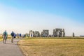 Tourists walking up path to ancient stone circle out in the middle of a plain- on hottest day in English Royalty Free Stock Photo