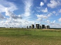 Stonehenge under blue sky and white clouds