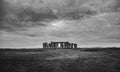 Stonehenge under dramatic clouds in black and white. Royalty Free Stock Photo