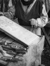 Stonemason carves the stone with a wooden hammer and chisel Royalty Free Stock Photo