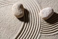 Stones across sand lines for concept of direction and change Royalty Free Stock Photo