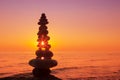 Stones balance on a background of sea sunset. Concept of harmony