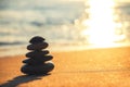 Stones balance on beach, sunrise shot. Zen meditation.