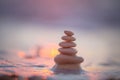 Stones balance on beach, sunrise shot. Zen meditation and relaxation Royalty Free Stock Photo