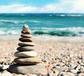 Stones balance, pebbles stack over blue sea in Crimea. Royalty Free Stock Photo
