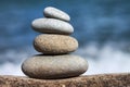 Stones balance, pebbles stack over blue sea in Croatia. Blue sky on sunny adriatic coast in summer Royalty Free Stock Photo