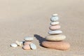 Stones balance on sand background Royalty Free Stock Photo