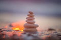 Stones balance on beach, sunrise shot. Zen meditation and relaxation