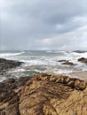 STONES ON THE BEACH WITH CLOUDY SKY Royalty Free Stock Photo