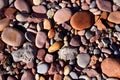 Stones on beach. Decorative texture of stones. Sea stones background. Colored stone on coastline Royalty Free Stock Photo